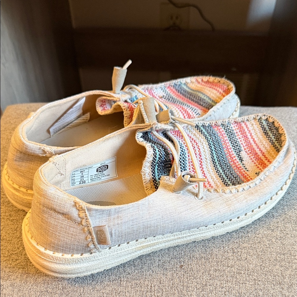 Beige Hey Dude Slip-Ons with Striped Knit Vamp